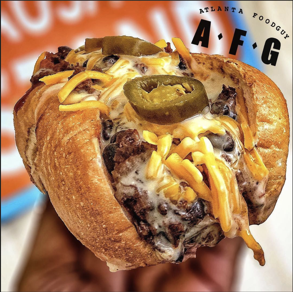 Loaded sandwich featuring Delia chicken sausage by Atlanta Foodguy